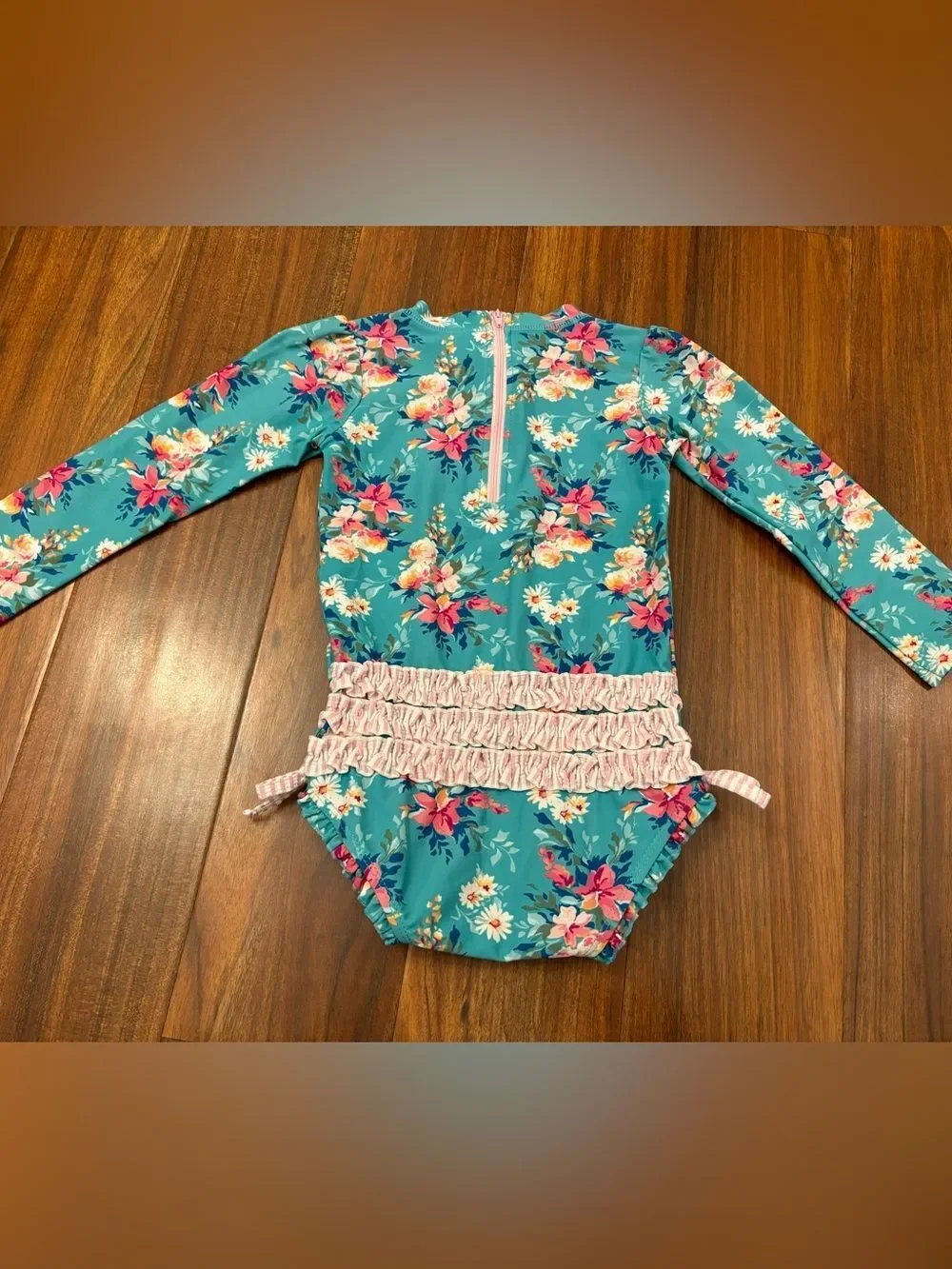 RuffleButts blue floral long sleeve rashguard one piece bathing suit